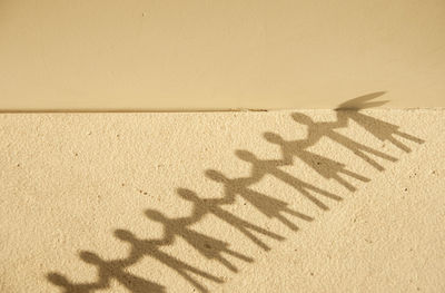 High angle view of text on sand at beach