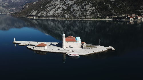 High angle view of sailboats moored on lake