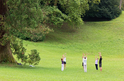 Group of people playing on golf course