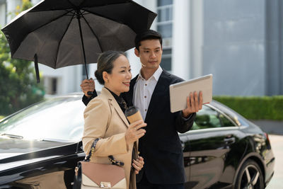 Portrait of young woman holding umbrella