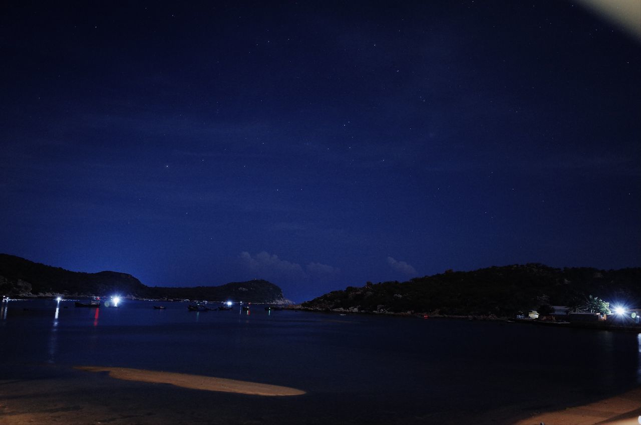 VIEW OF SEA AGAINST SKY AT NIGHT
