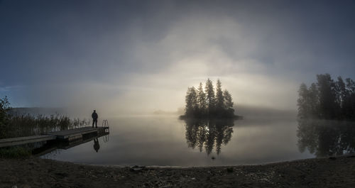 Reflection of trees in calm lake