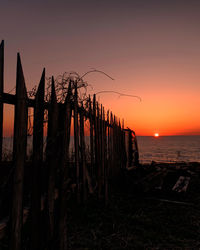 Scenic view of beach against sky during sunset