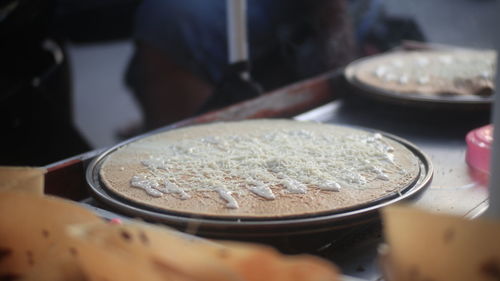 Close-up of preparing food on table