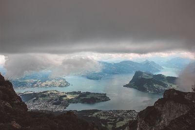 Panoramic view of sea and mountains against sky