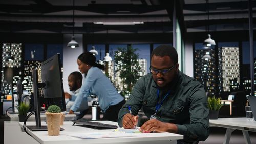 Portrait of young man working at table