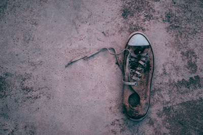 High angle view of abandoned shoes on floor