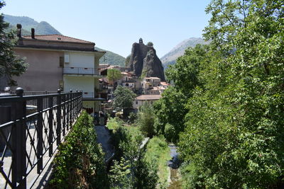 Panoramic view of trees and mountains against clear sky