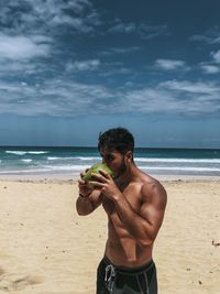 Enjoying coconut at the beach