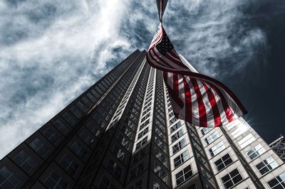 Low angle view of building against cloudy sky