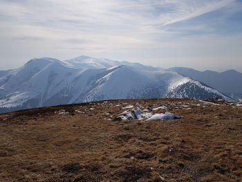Scenic view of snowcapped mountains against sky