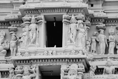 Statue against historic building