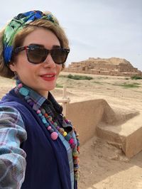 Low angle view of young woman wearing hat