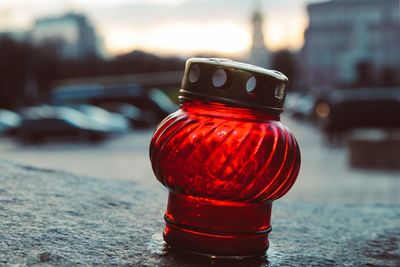 Close-up of red bottle in jar