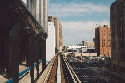 View of railroad tracks against cloudy sky