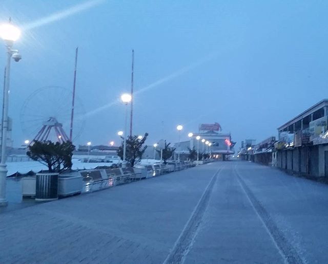 illuminated, street light, the way forward, night, lighting equipment, road, transportation, diminishing perspective, clear sky, snow, street, sky, cold temperature, blue, vanishing point, winter, copy space, in a row, empty, lamp post