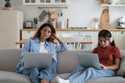 Young woman using laptop at home