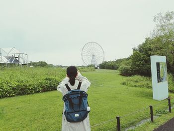 Man standing in park against clear sky