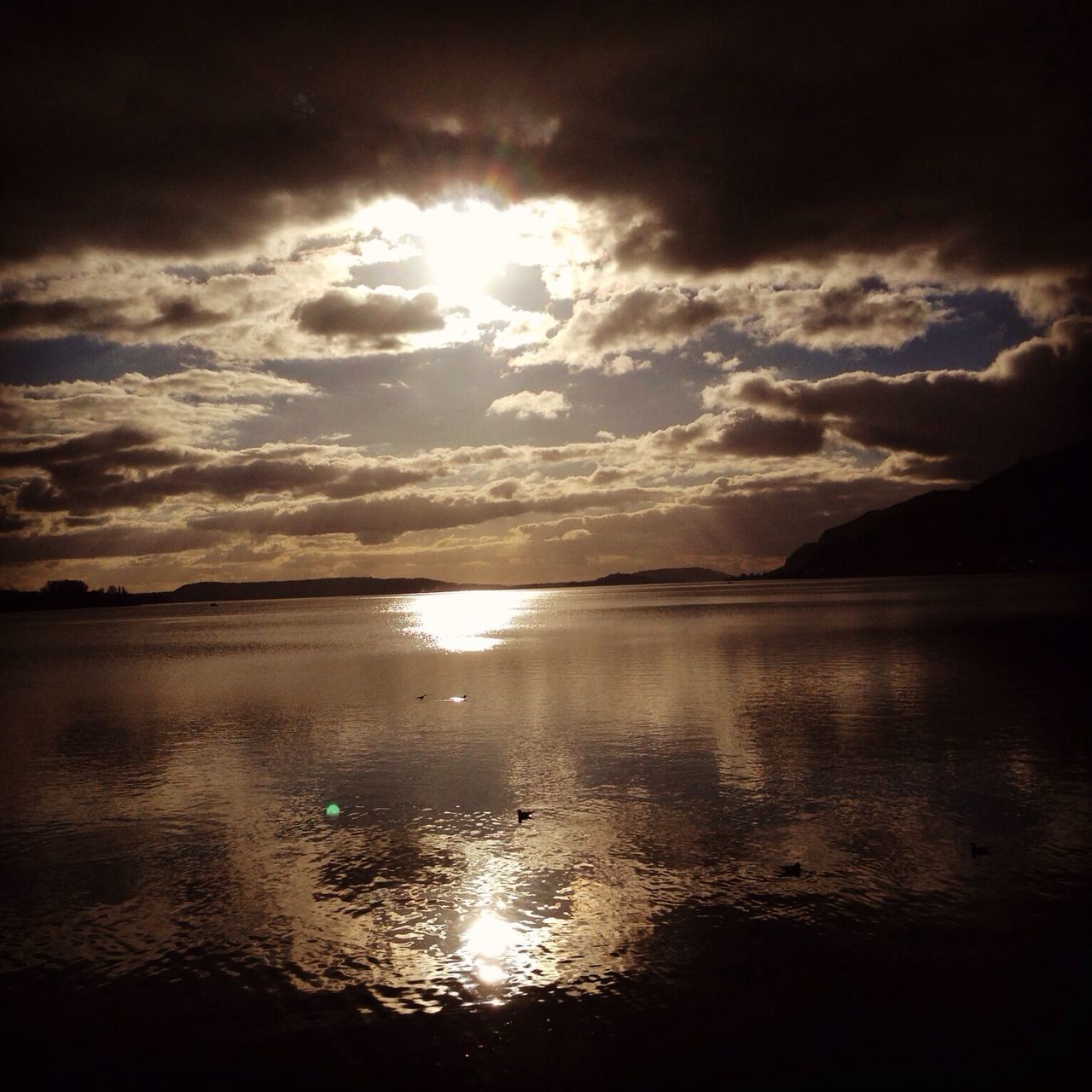 water, sky, tranquil scene, scenics, tranquility, cloud - sky, beauty in nature, reflection, sunset, sun, nature, cloudy, sea, cloud, idyllic, lake, silhouette, mountain, sunlight, waterfront