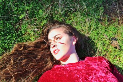 Close-up of young woman on grass