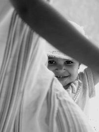 Portrait of boy covering face