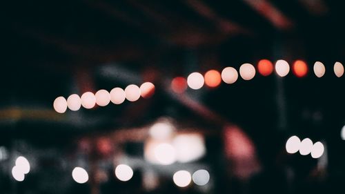 Defocused image of illuminated lights at night