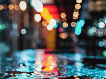 Defocused image of illuminated city at night