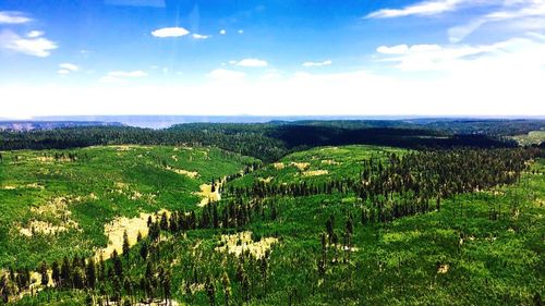 Scenic view of landscape against cloudy sky
