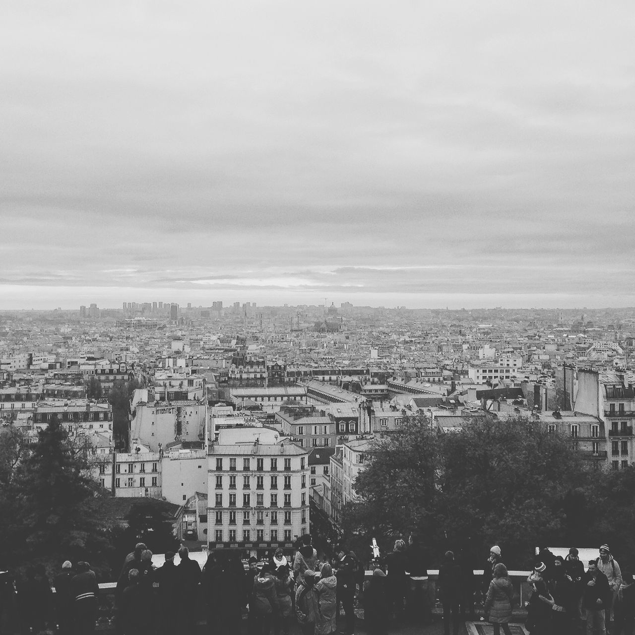 building exterior, architecture, cityscape, city, built structure, crowded, high angle view, sky, residential district, residential building, residential structure, cloud - sky, city life, aerial view, skyscraper, outdoors, tower, community, cloudy, no people