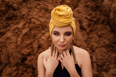 Portrait of young woman wearing hat