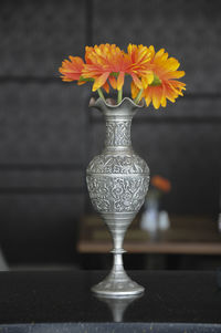 Close-up of flower vase on table