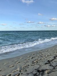 Scenic view of beach against sky
