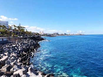 Scenic view of sea against blue sky