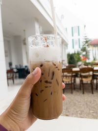 Close-up of hand holding drink