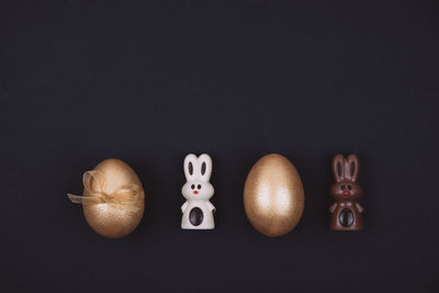 Directly above shot of eggs against black background