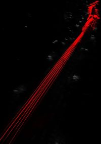 High angle view of light trails on road at night