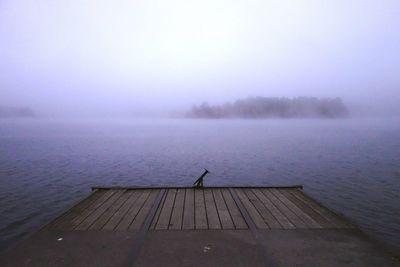 Scenic view of lake against cloudy sky