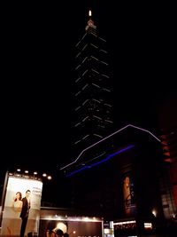 Low angle view of illuminated building at night