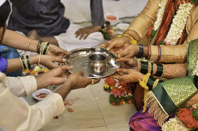 Close-up of people drinking tea