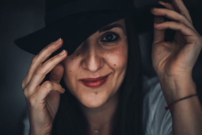 Close-up portrait of a smiling young woman