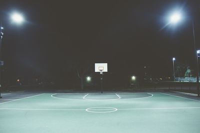 View of basketball hoop at night