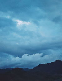 Scenic view of landscape against cloudy sky