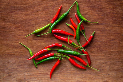 Close-up of red chili peppers on table