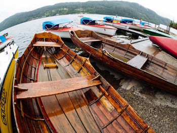 High angle view of boats moored at beach against sky