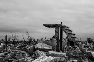 Abandoned structure on land against sky