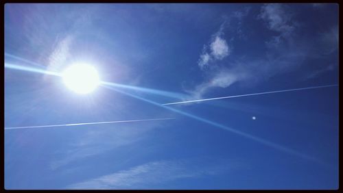 Low angle view of vapor trails in sky