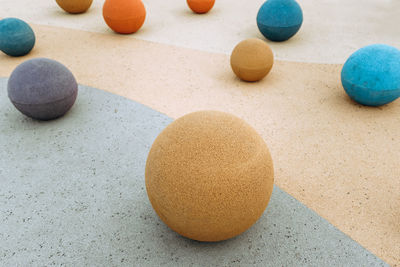 Close-up of multi colored balls on sand
