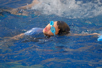 Portrait of woman swimming in sea