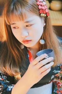 Close-up of beautiful woman drinking water