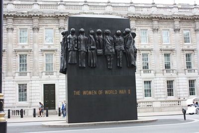 Statue in front of building